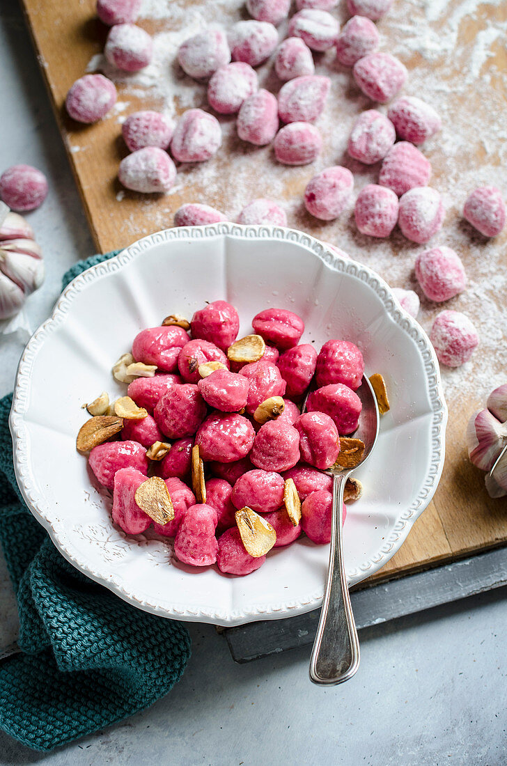 Homemade beetroot gnocchi with garlic