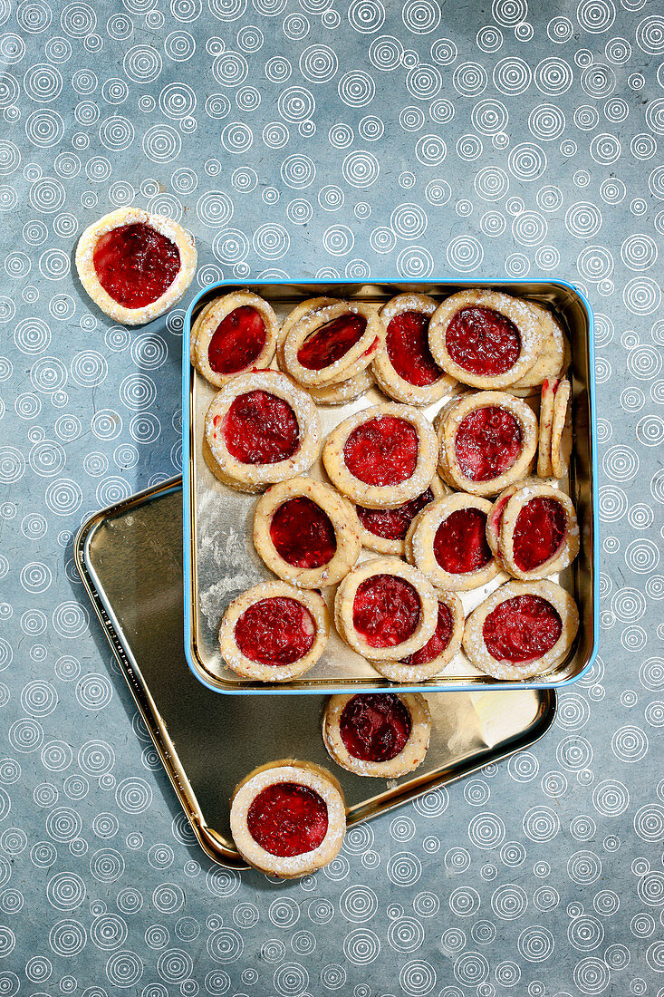 Shortbread jam-filled biscuits in a biscuit tin