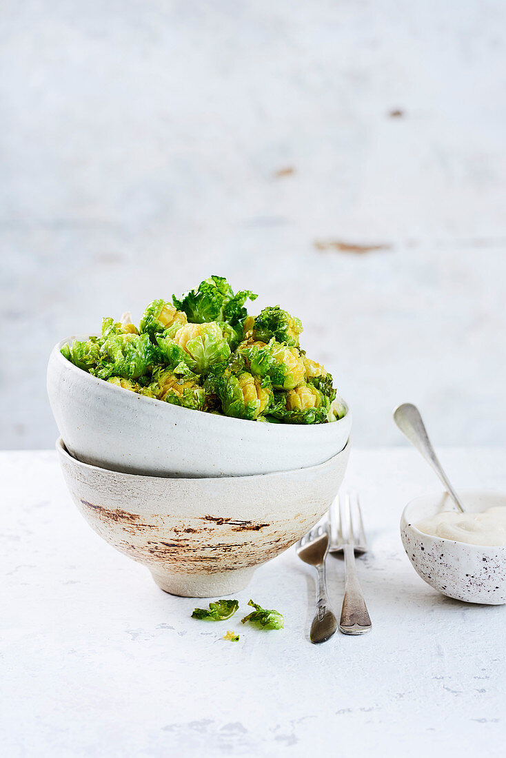 Deep-fried blooming sprouts with tahini dip