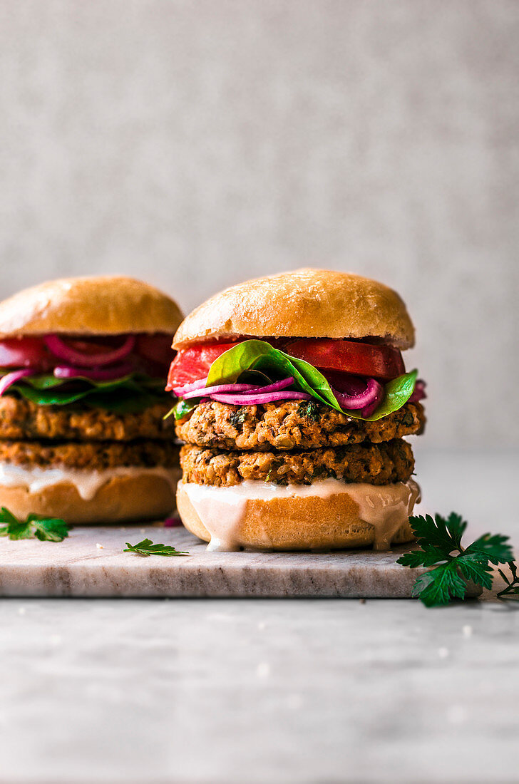 Sweet Potato Chickpea Burgers on a marble background