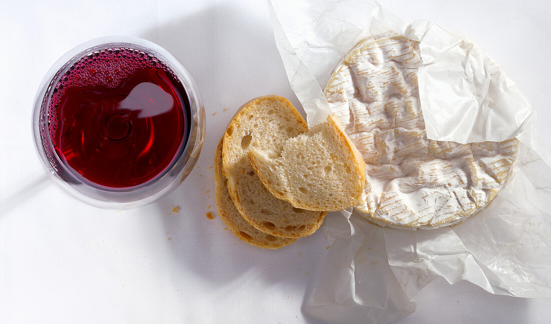Camembert with baguette and a glass of red wine
