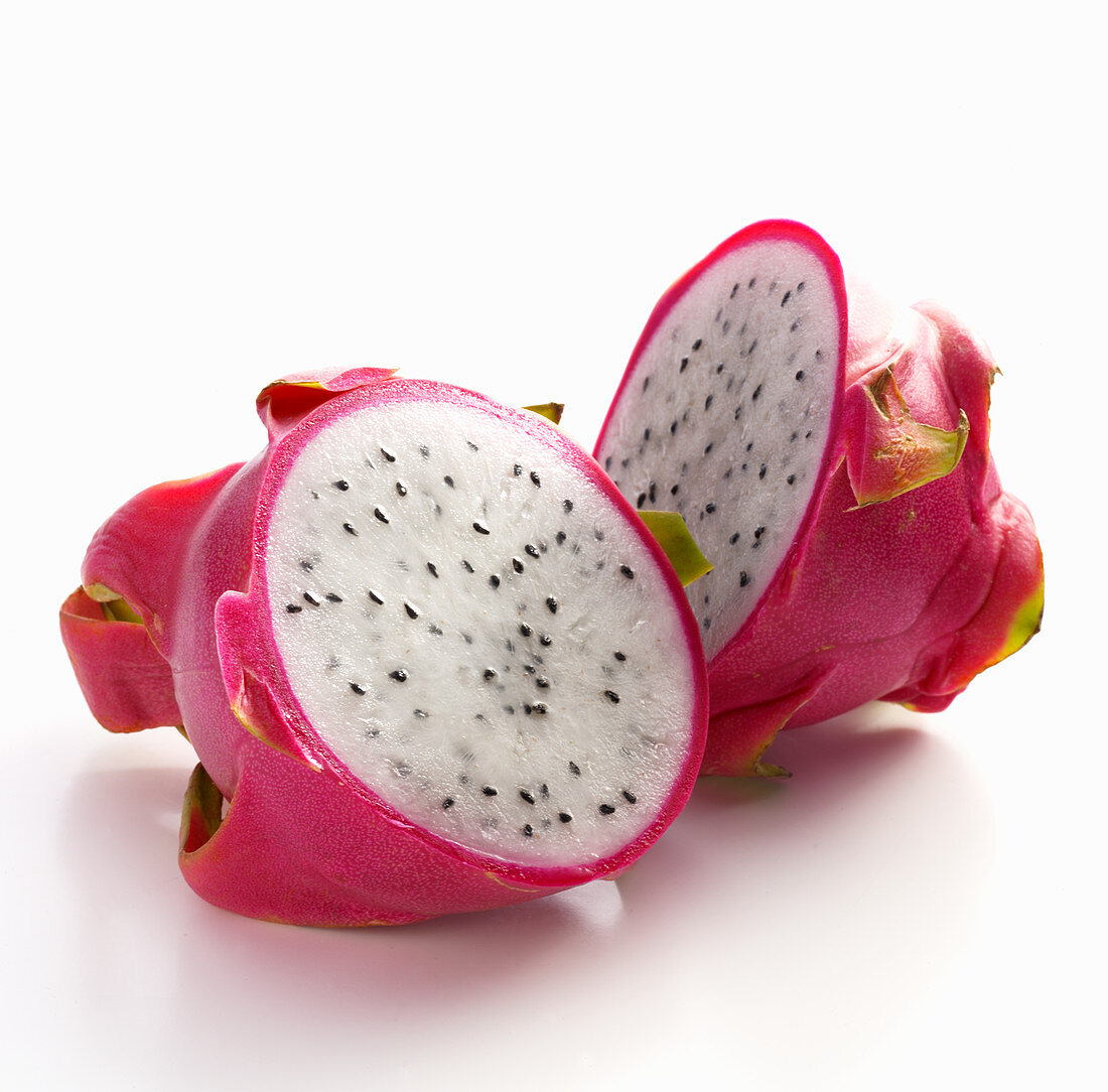 A halved dragon fruit against a white background