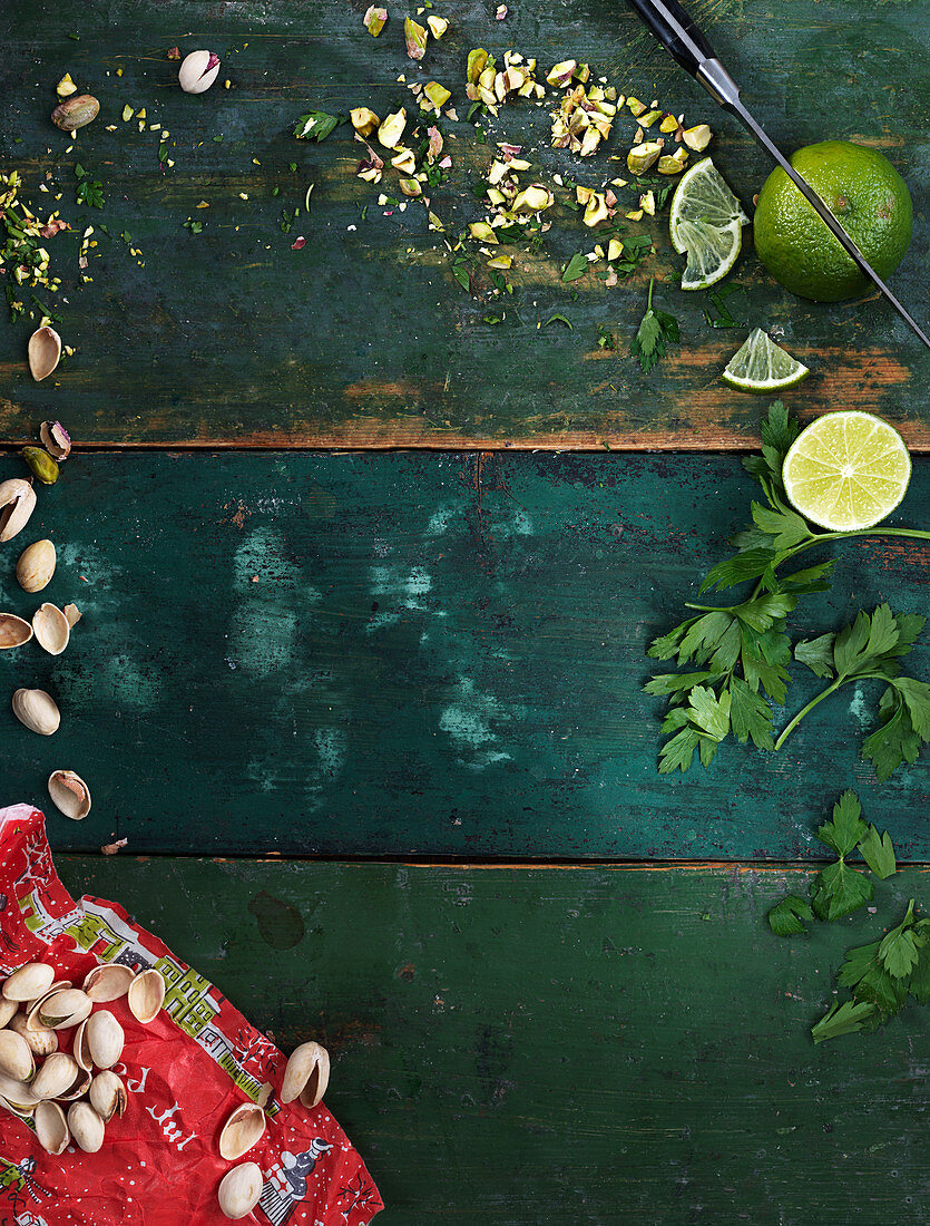 Pistachios, lime and parsley background