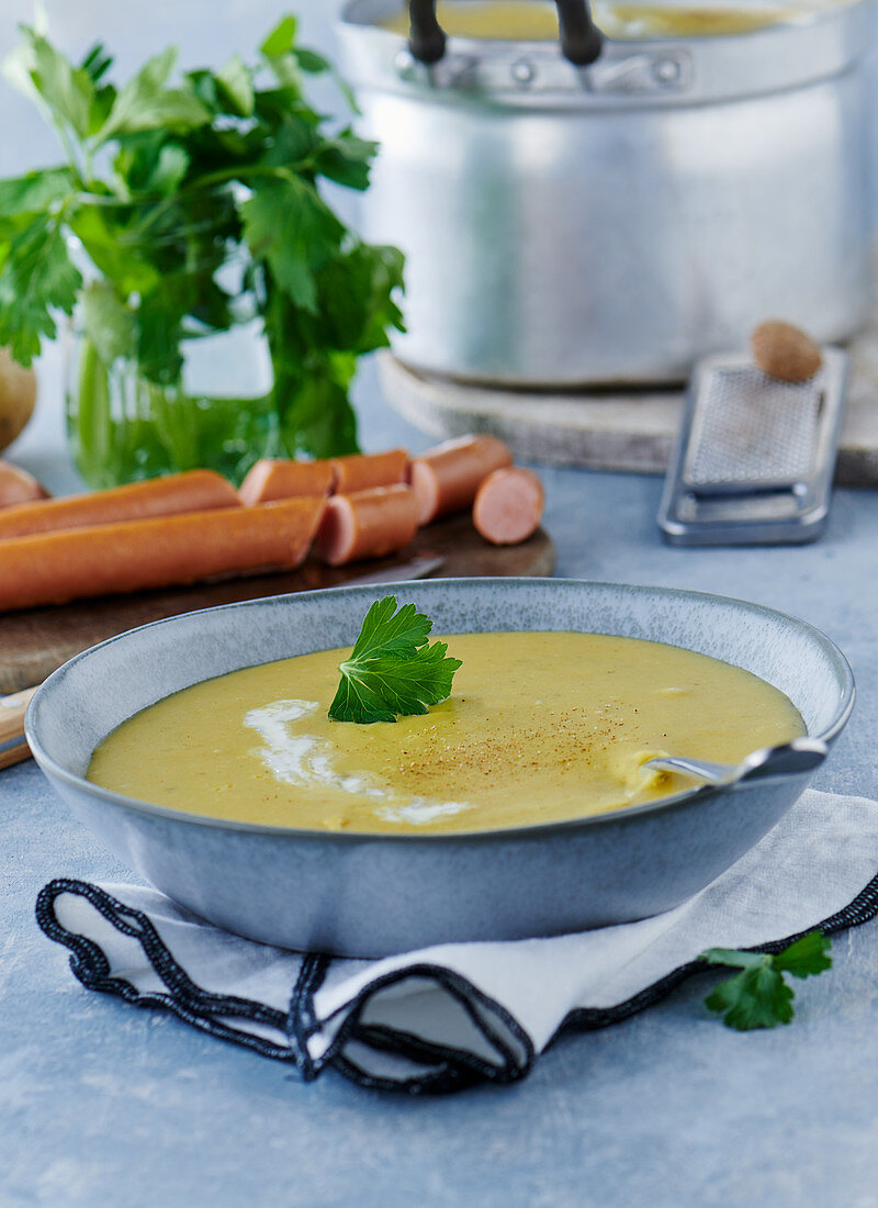 Potato soup with bockwurst and parsley