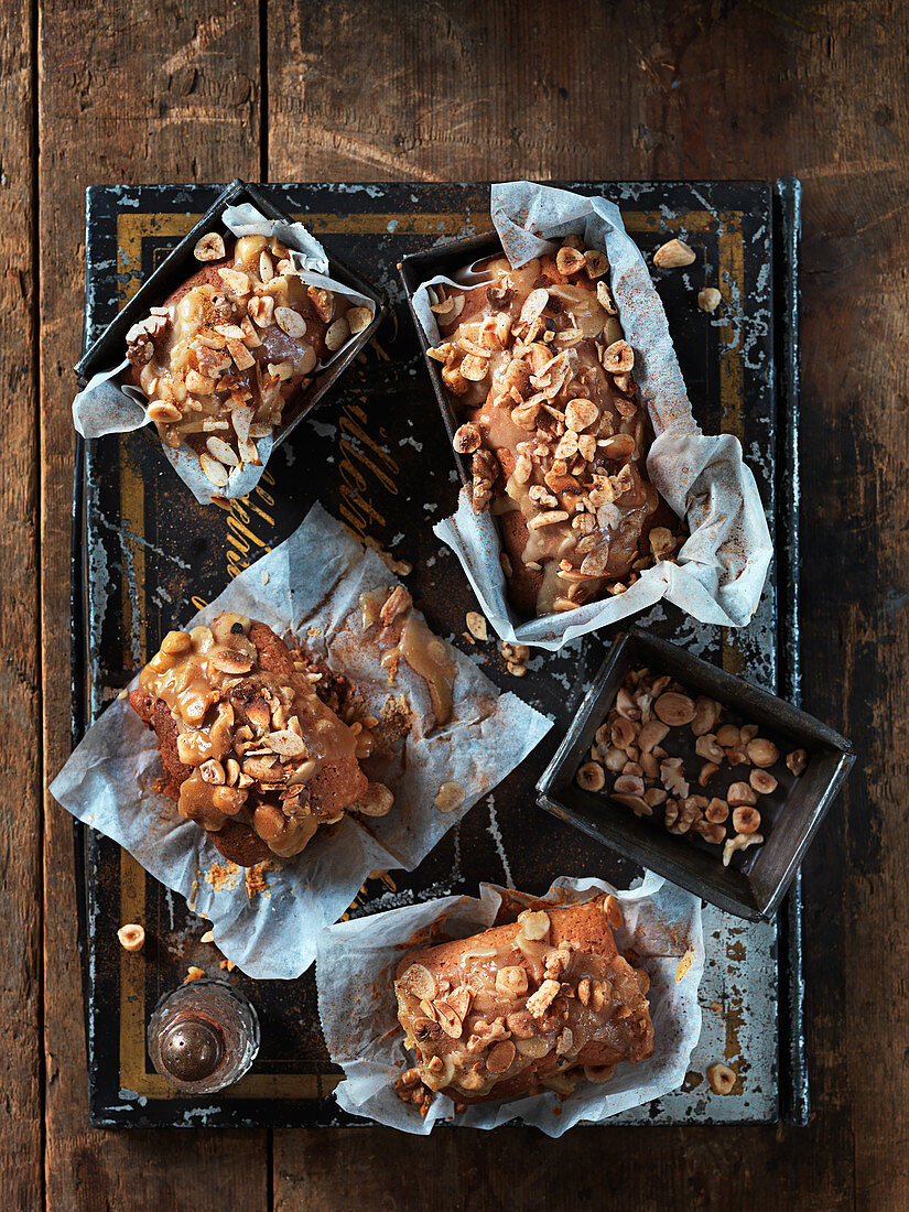 Small Christmas cakes with caramel sauce and hazelnuts