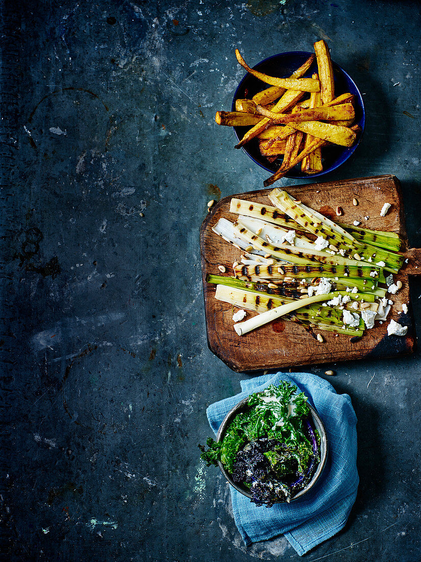 Griddled leeks and goat’s cheese with parsnip fries and kale