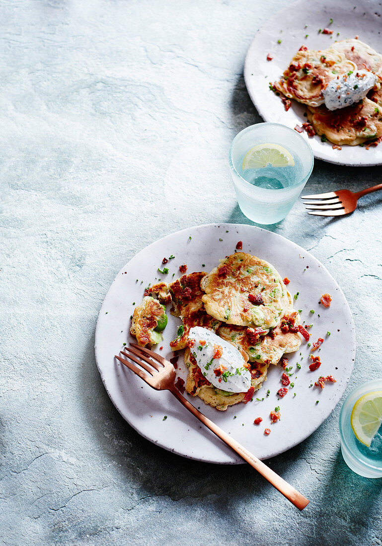 Broad bean fritters with herby whipped goat's cheese and bacon crumbs