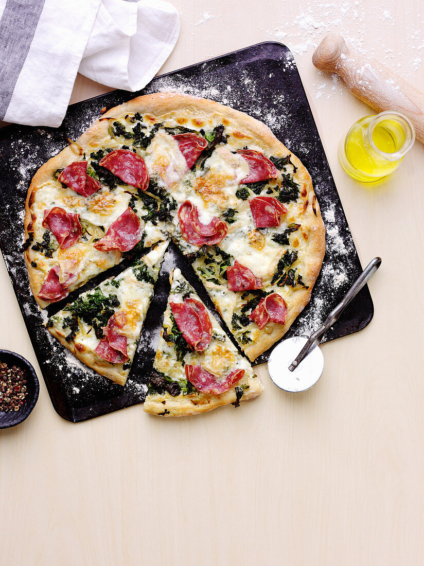 Salami, garlic greens and taleggio pizza