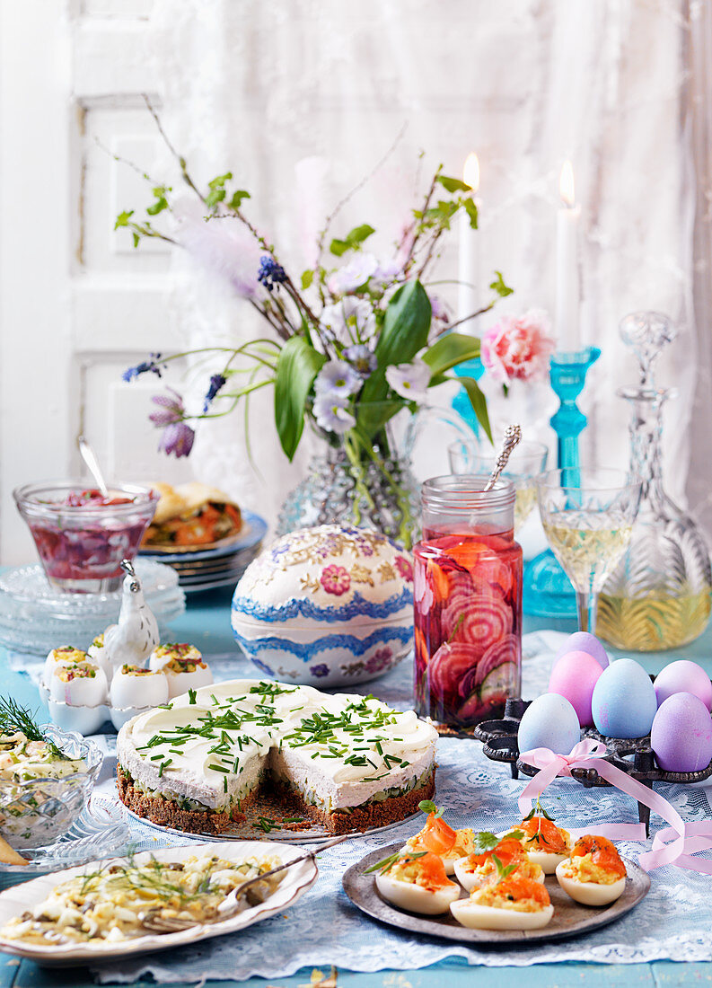 Easter buffet with eggs, herring, pie and cheesecake