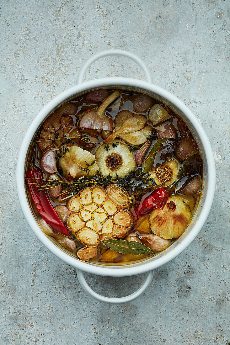 Garlic confit with chillies and herbs