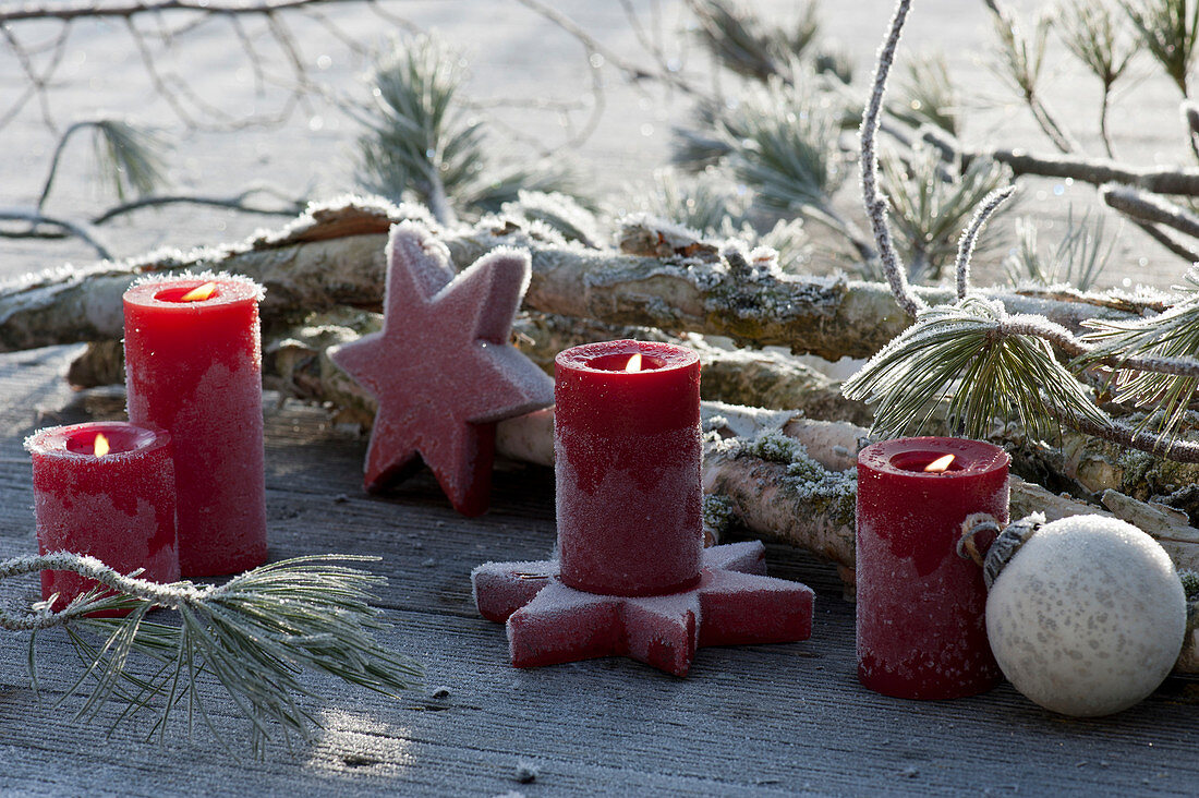 Candles, balls and stars in hoarfrost