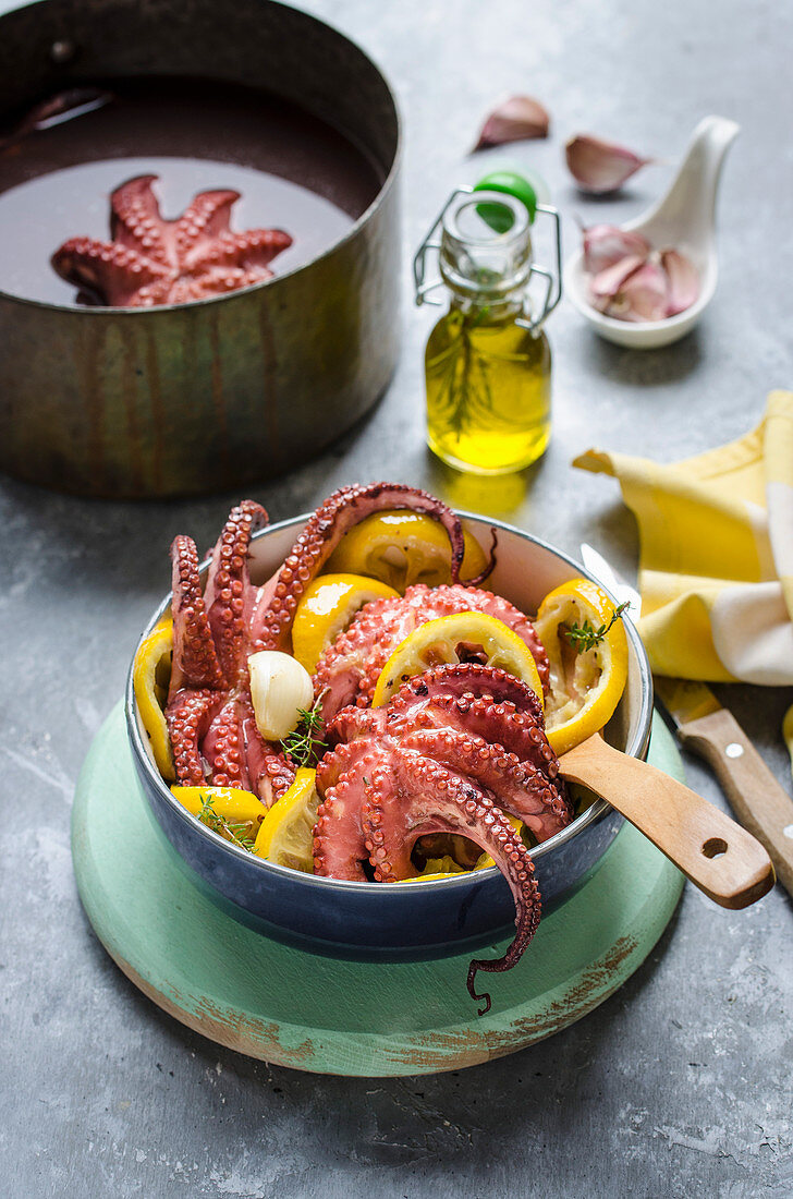 Warm octopus salad with fried lemon slices and garlic
