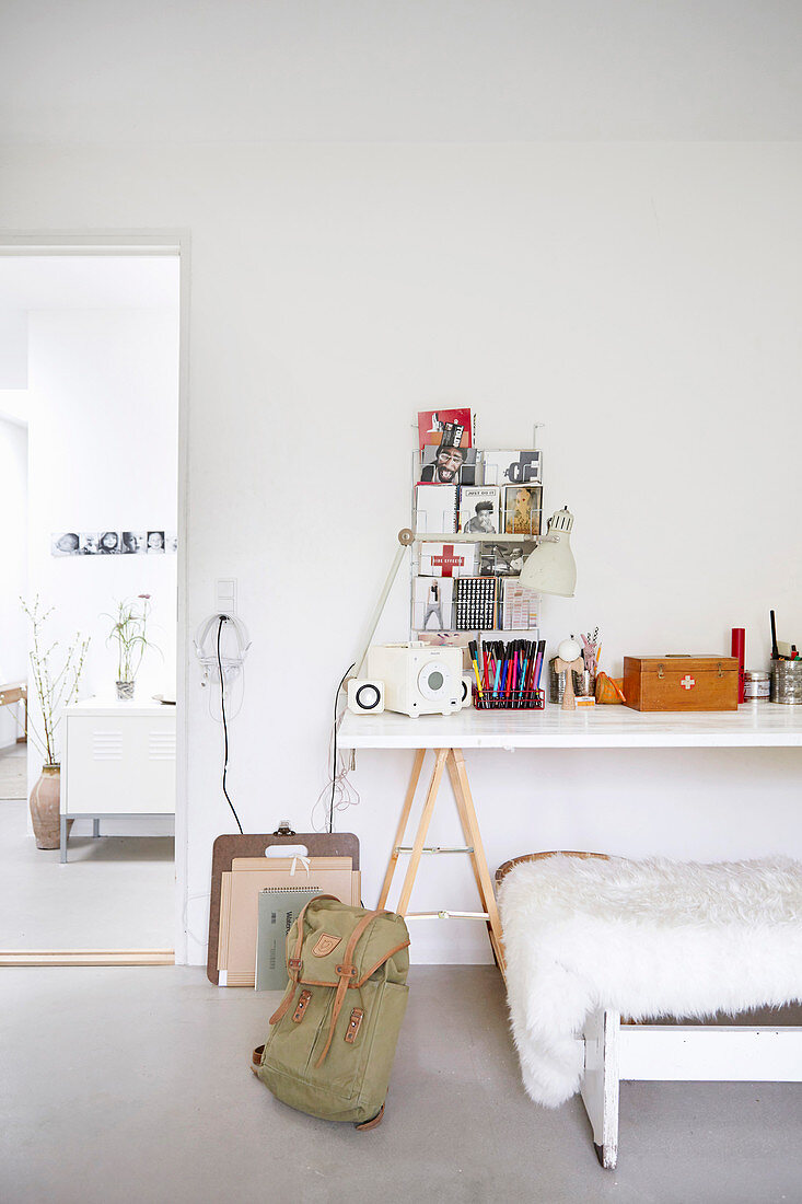 Desk on trestles in teenagers bedroom decorated in white