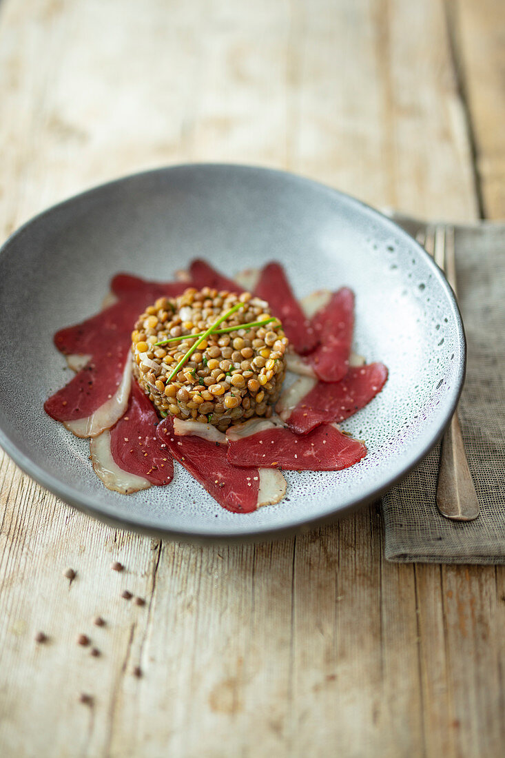 Lentil salad with smoked goose breast