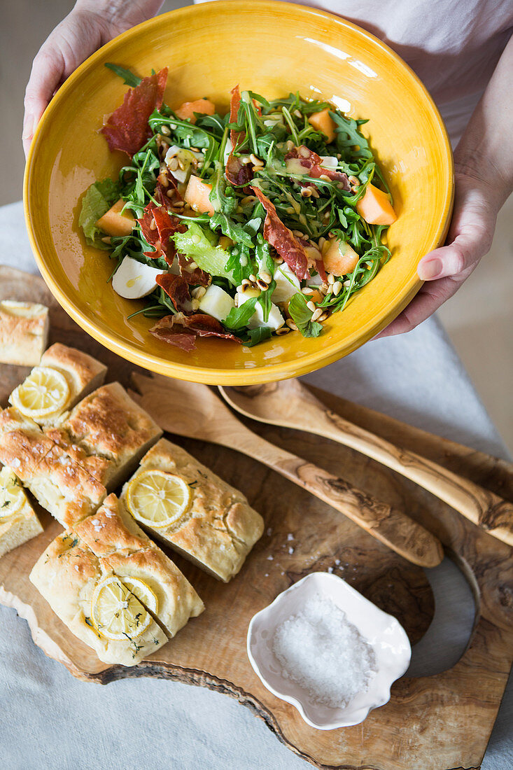 Rocket salad with bacon and melon