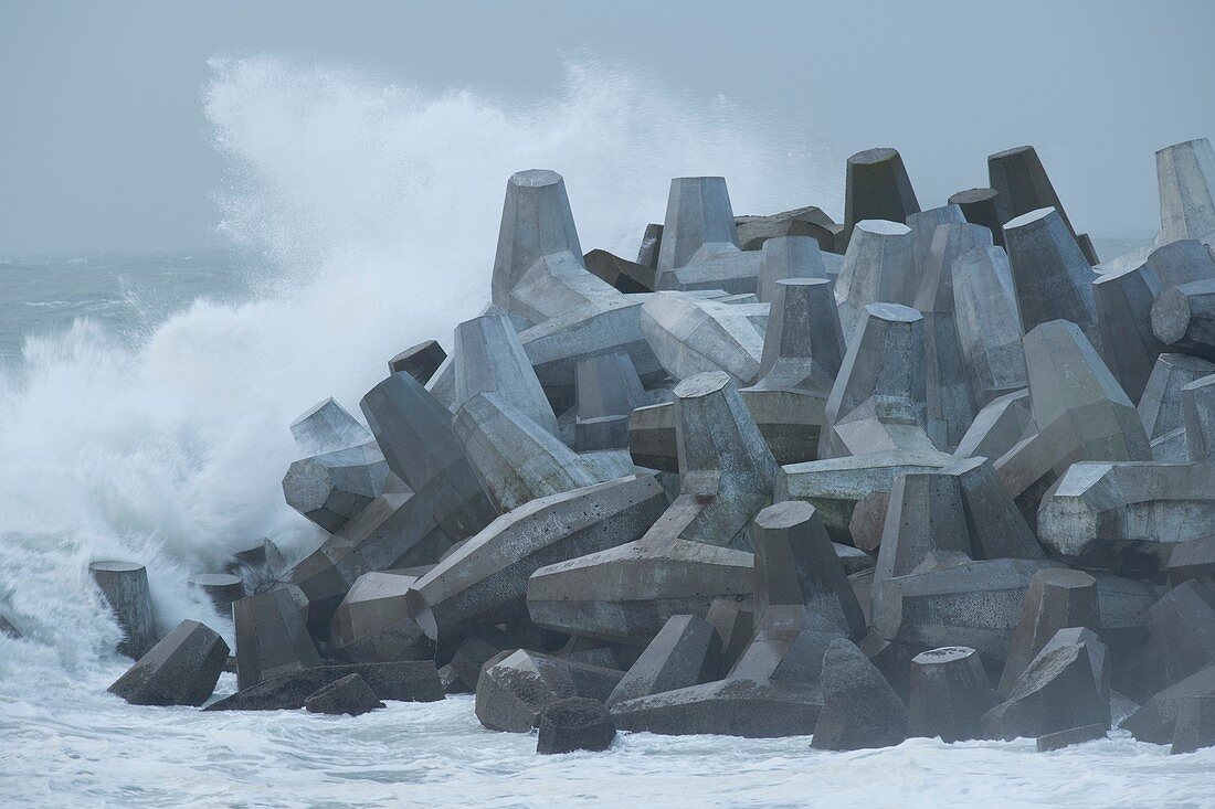 Dolos harbour wall with waves in winter