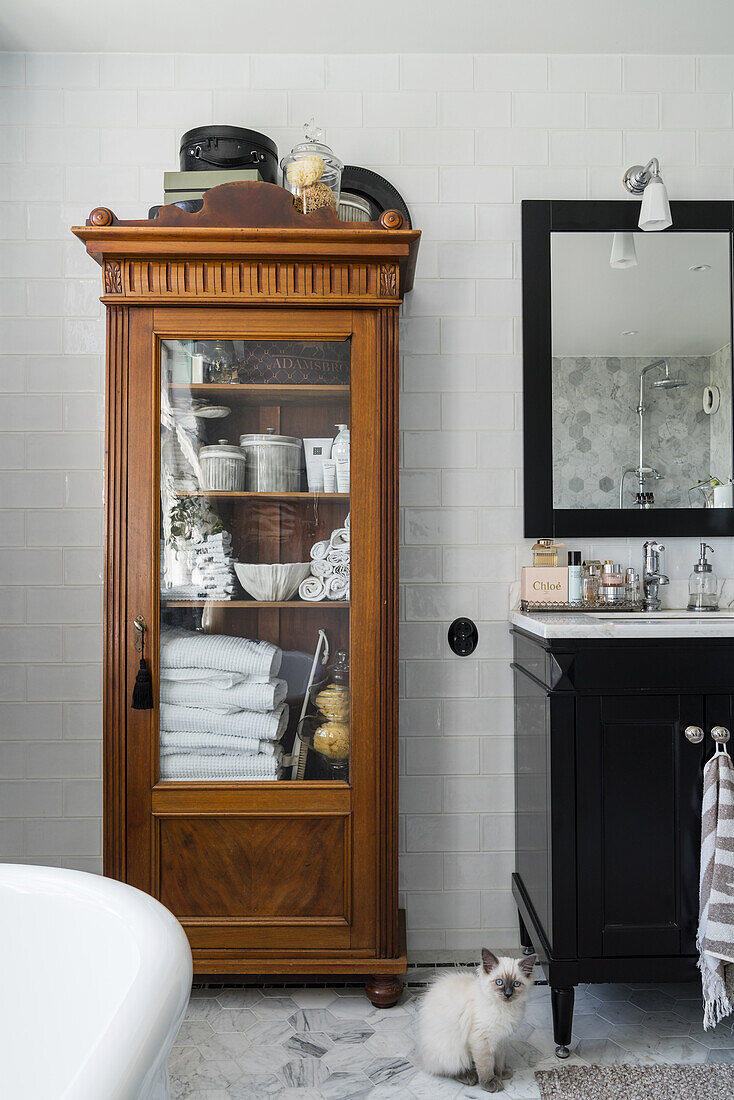 Antique linen cupboard in bathroom