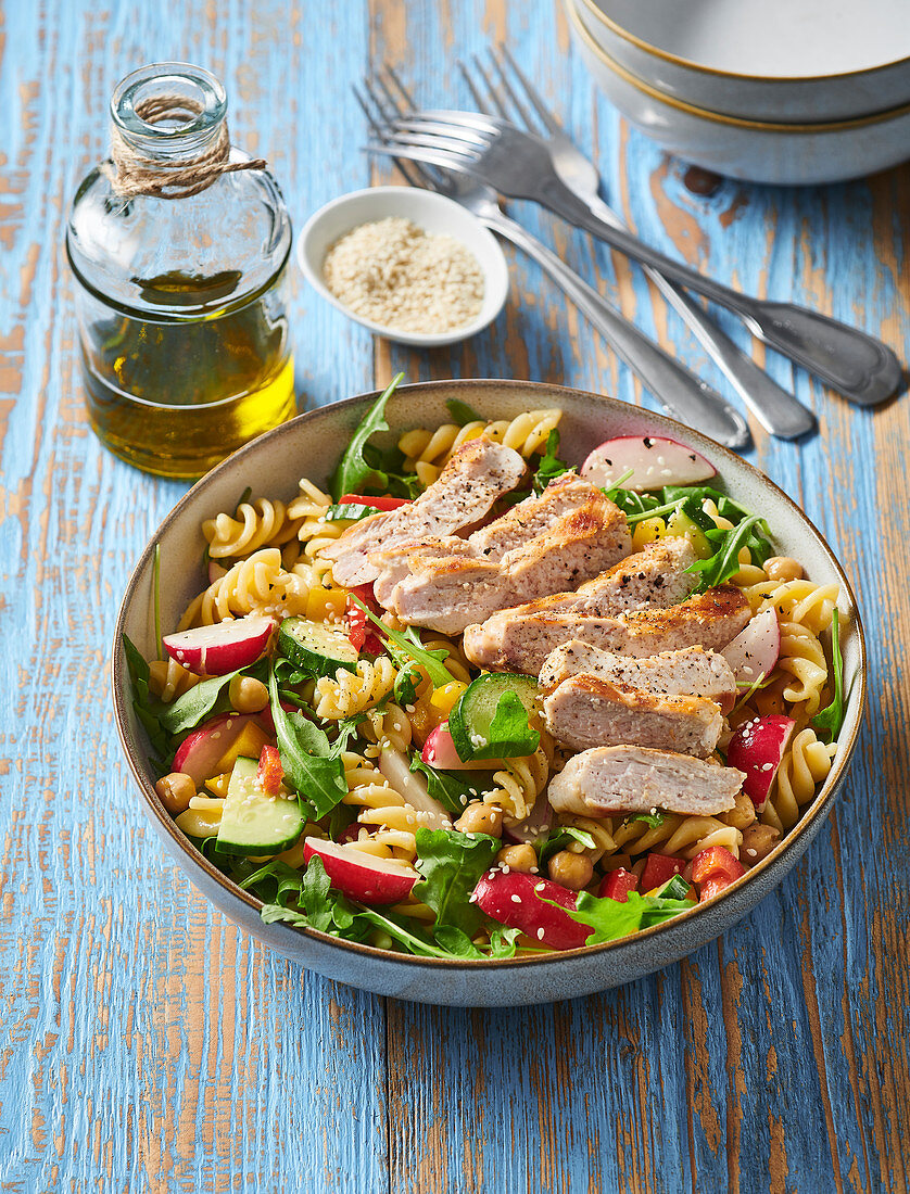 Pasta salad with chicken breast and sesame