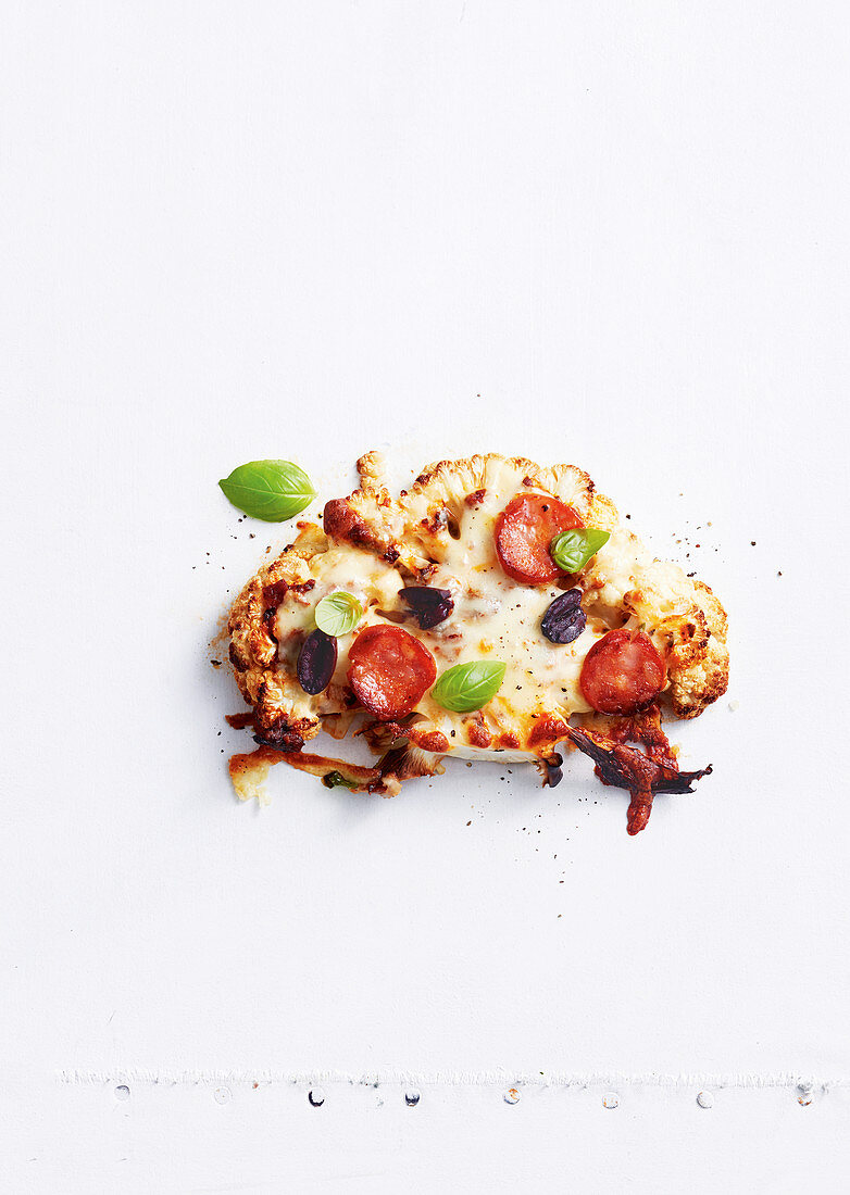 Cauliflower pizza with peperoni salami and mozzarella