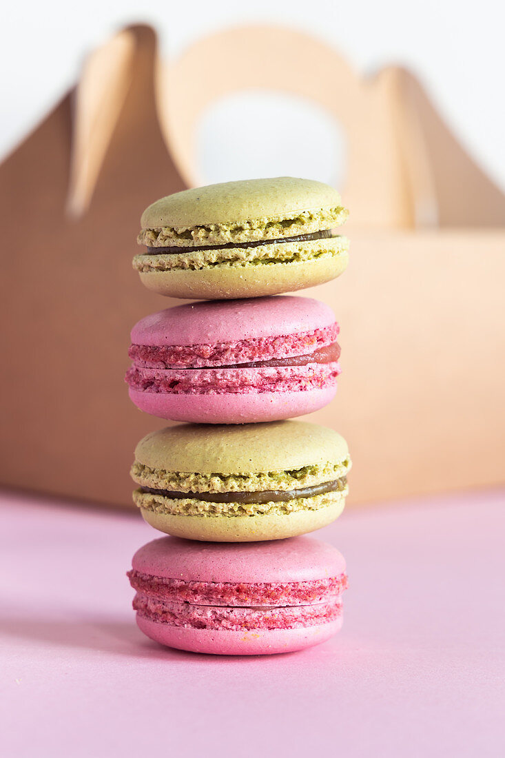 Pistachio and strawberry macarons stacked