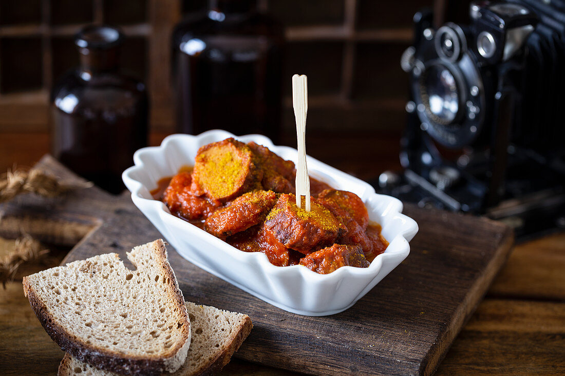 Homemade curried sausage with bread