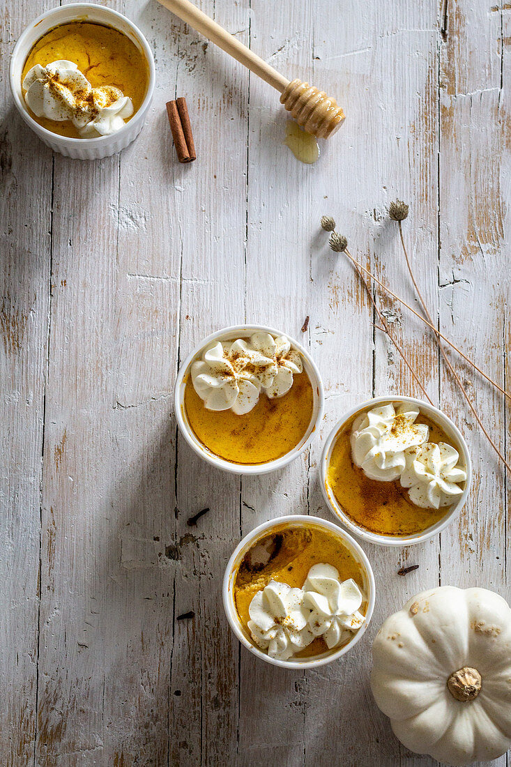 Small pumpkin cheesecakes with whipped cream