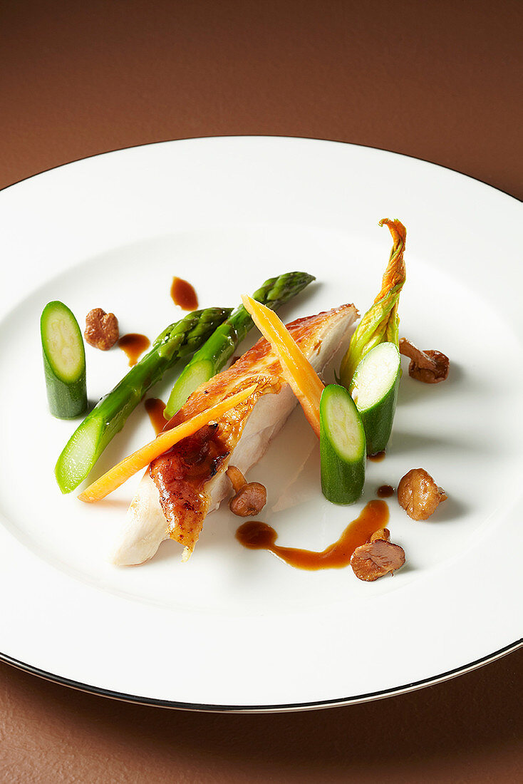 Roast poularde breast with green asparagus