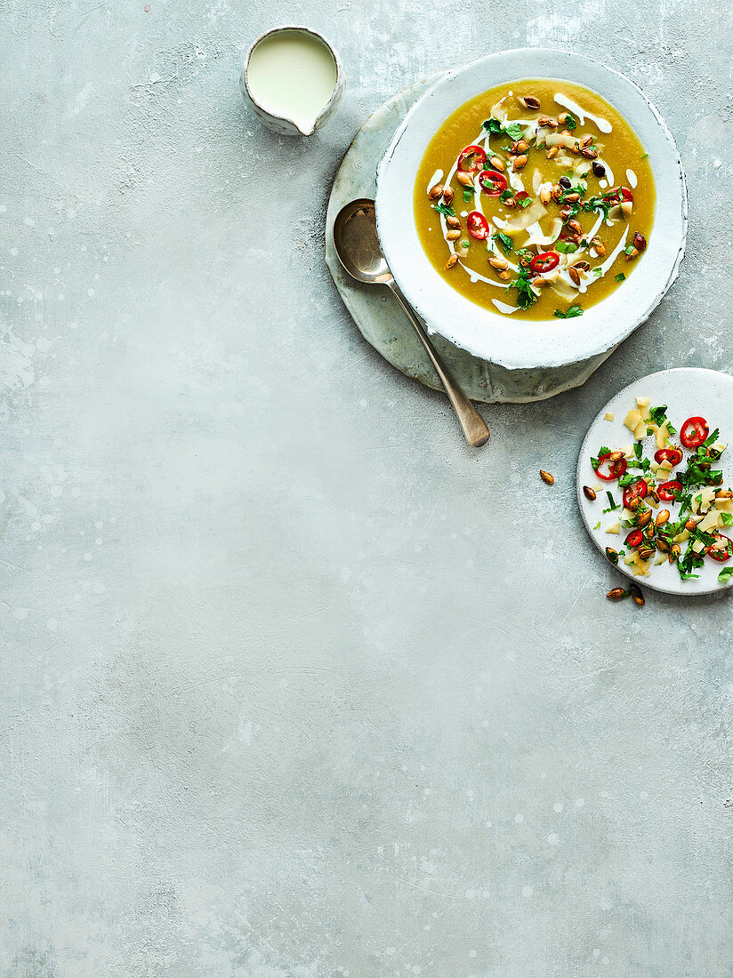Vegan pumpkin soup with coconut yoghurt and chilli
