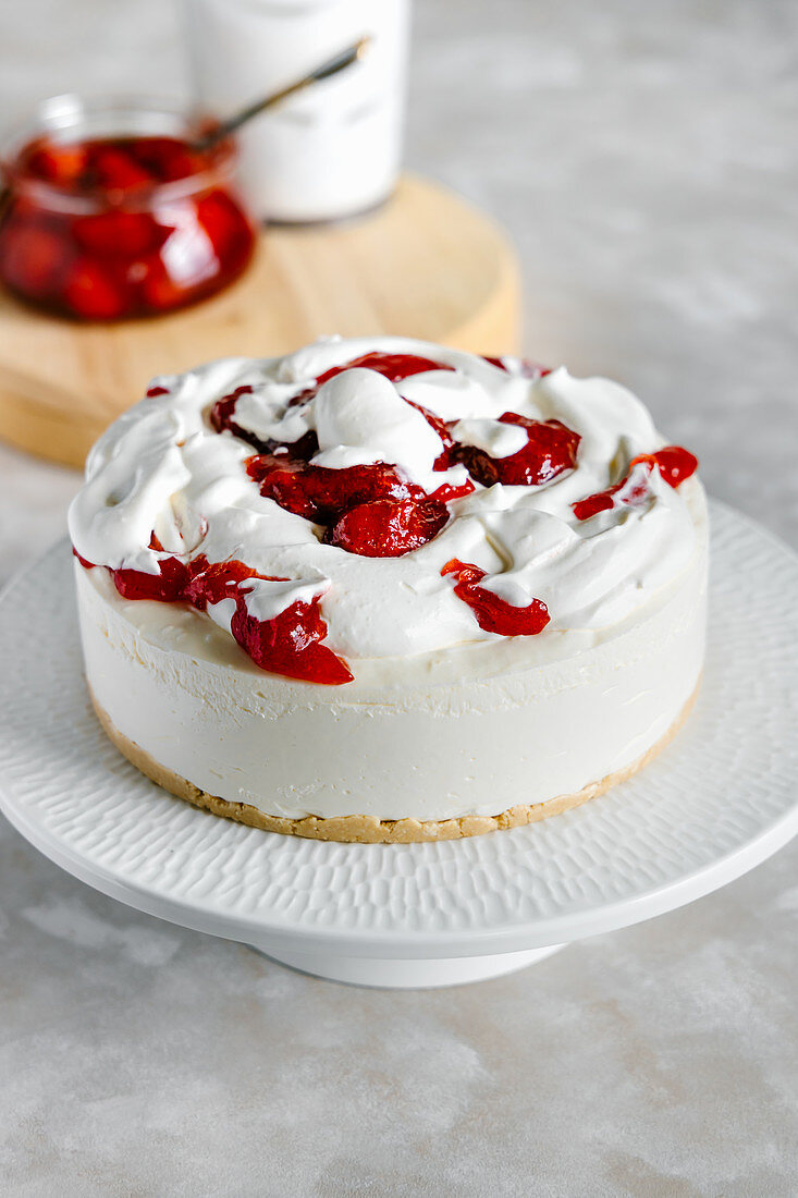 Vanilla coconut cheesecake with strawberry and whipped cream