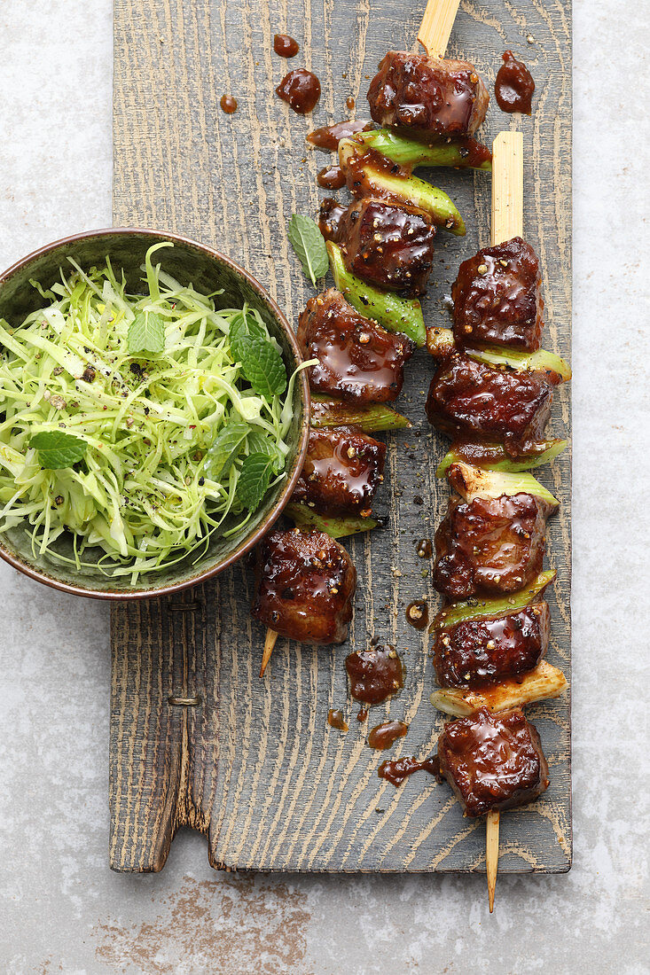 Yakitori steak skewers with a pointed cabbage salad