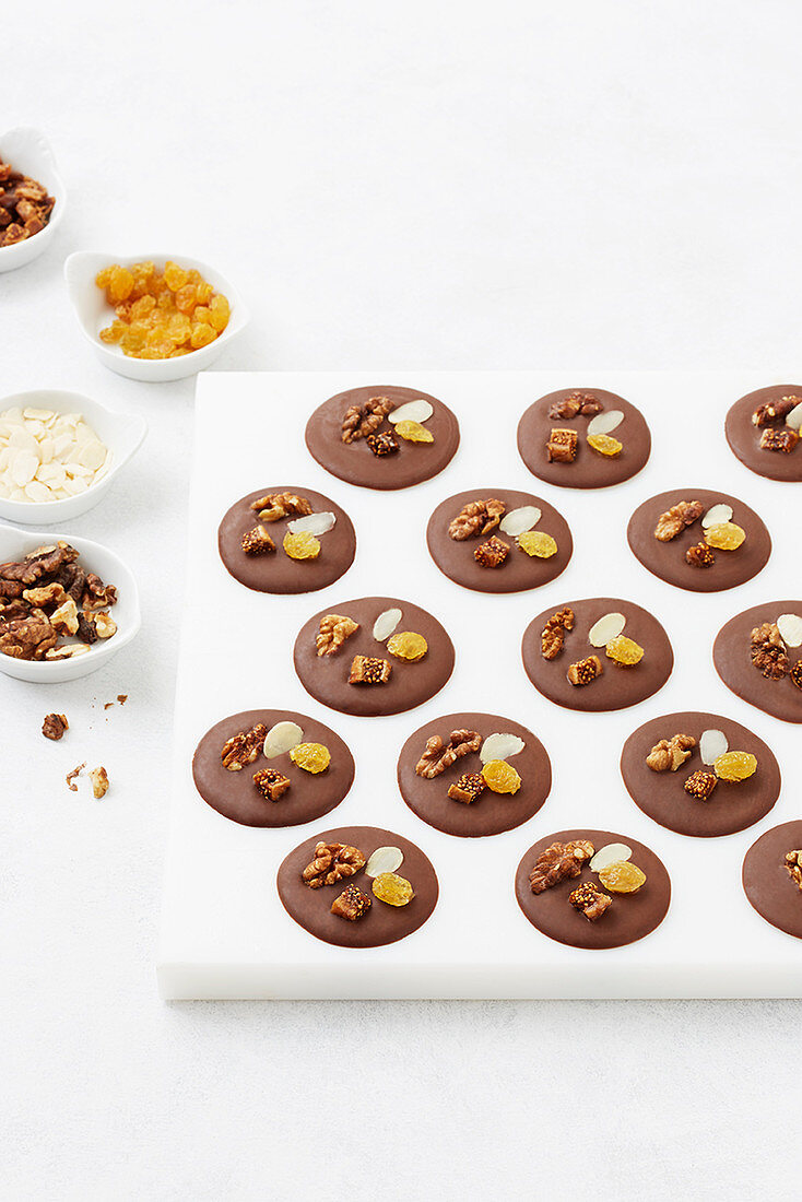 Chocolate mendiants with almonds and ginger