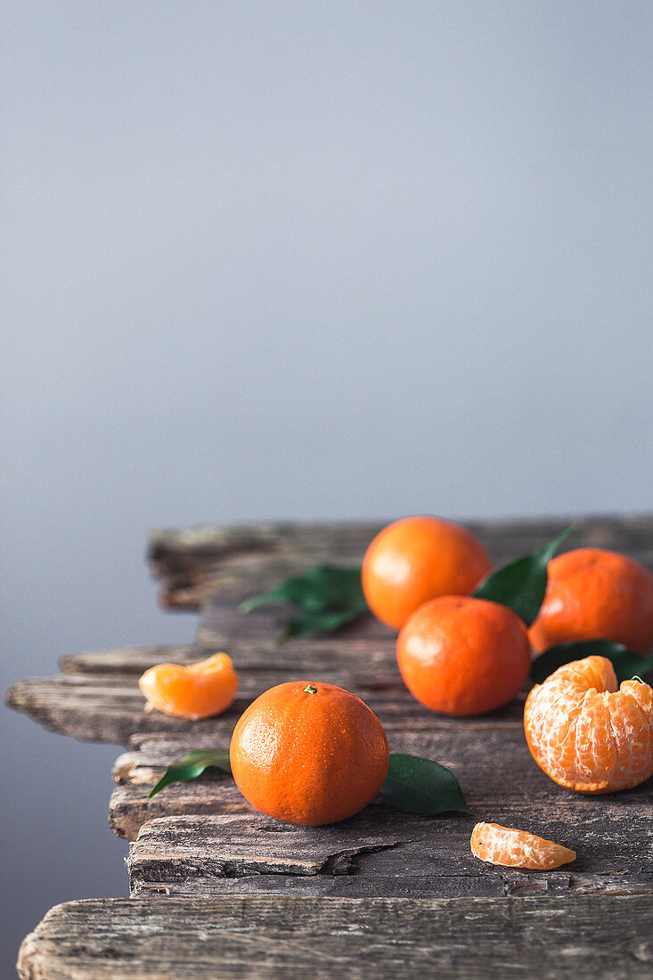 Clementines on a wooden surface
