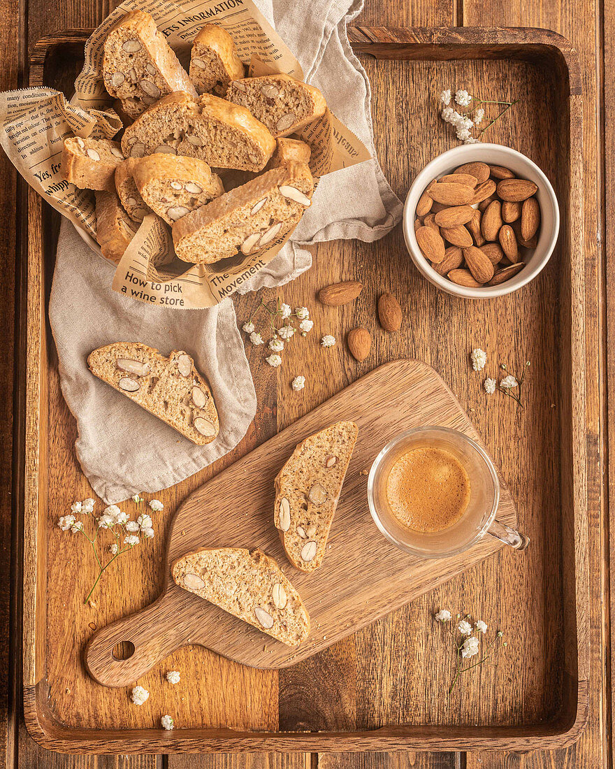Typical Catalan biscuits carquinyolis with roasted almonds served on wooden tray