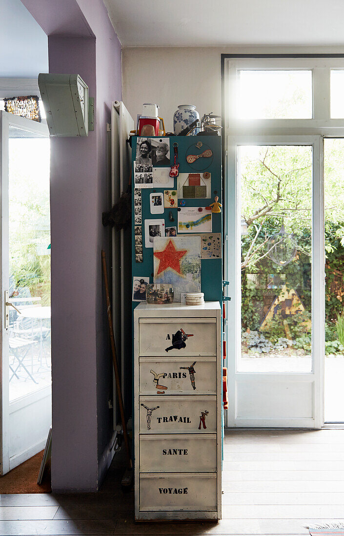 Vintage chest of drawers below pinboard