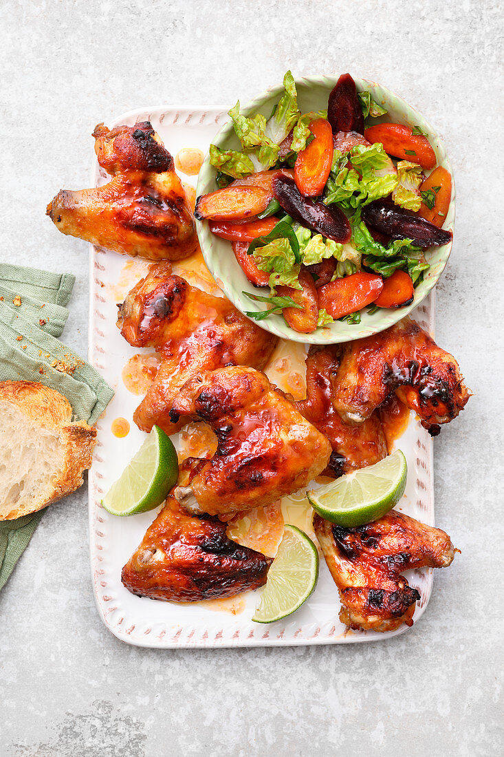 Asian chicken wings with lukewarm carrot salad