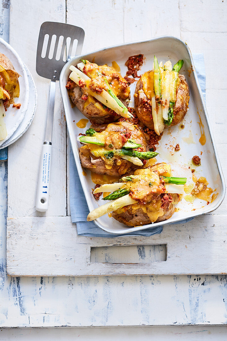 Stuffed baked potatoes with asparagus and cheddar cheese