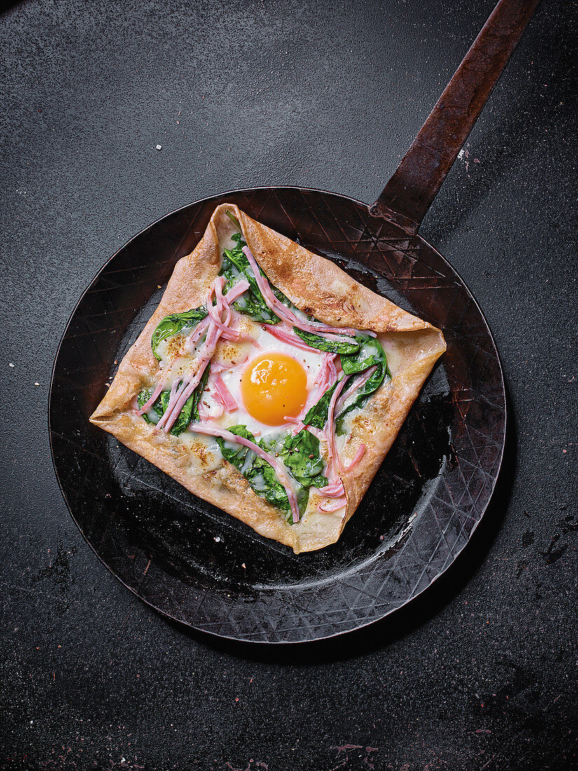 Buckwheat galette with ham, spinach, egg and comté