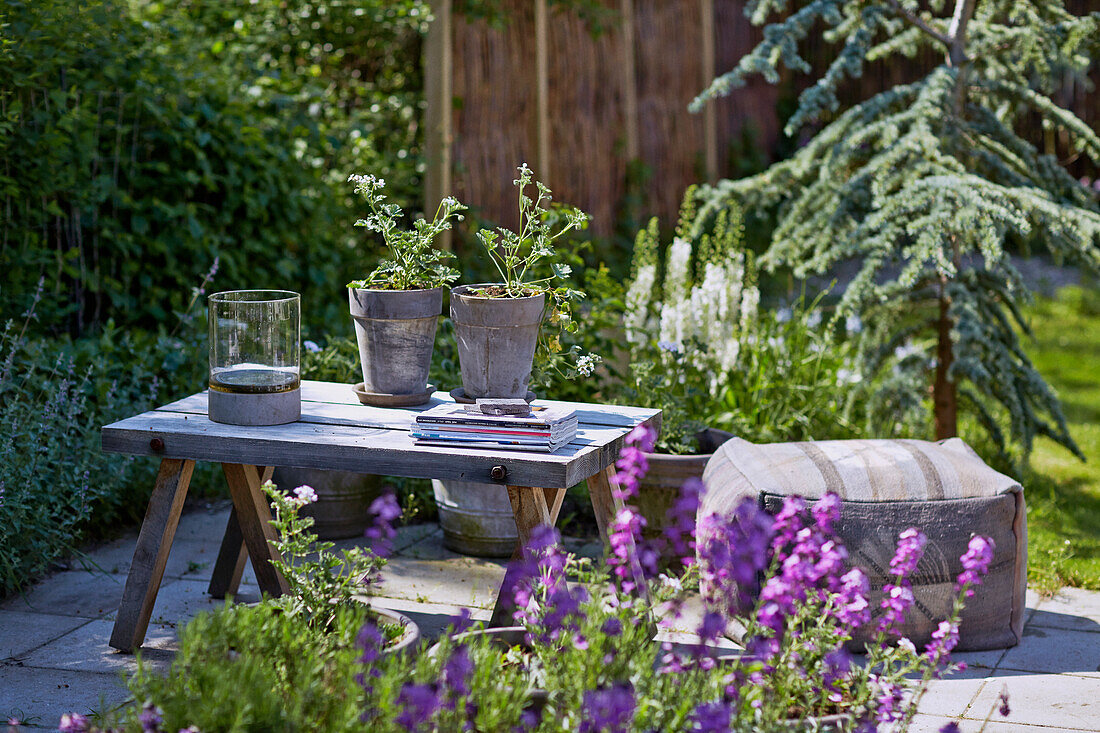 Wooden table and cushions on the terrace