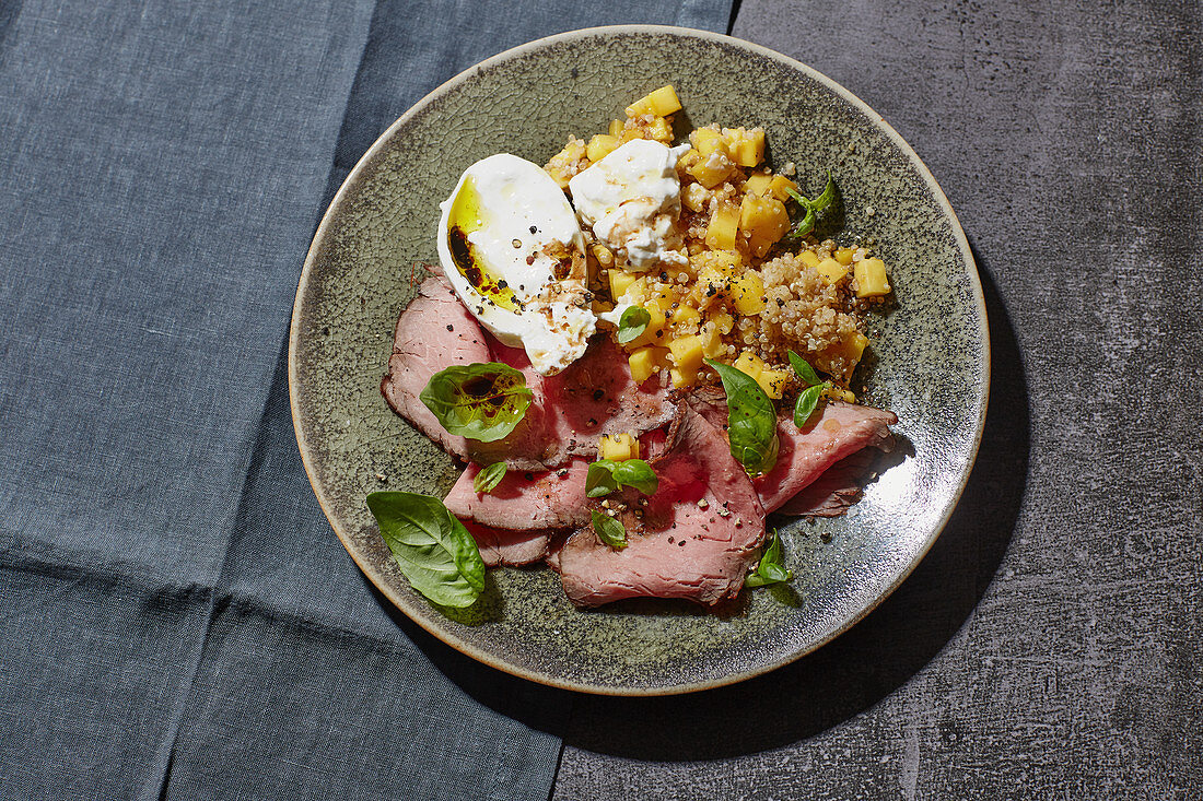 Roast beef and mango salad with quinoa and burrata