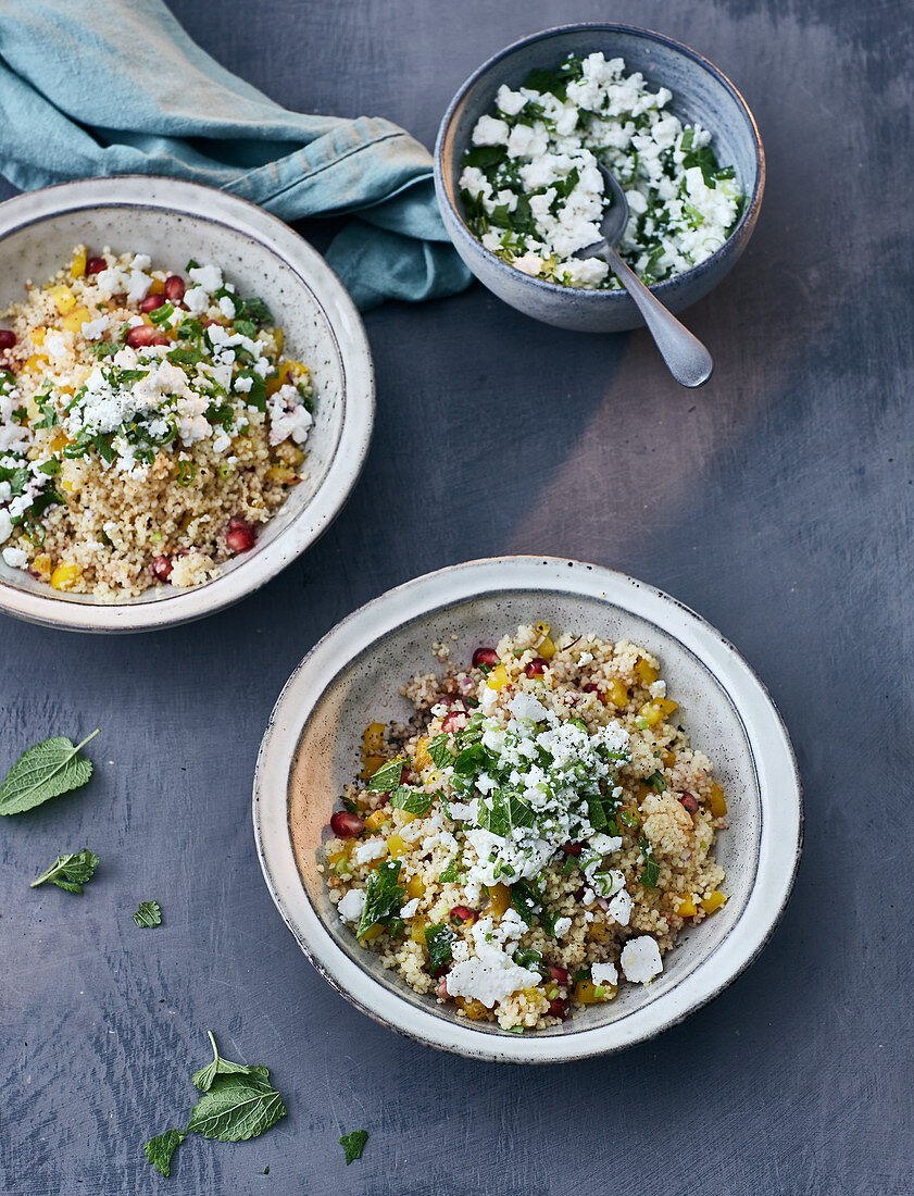 Warm couscous salad with pomegranate and sheep's cheese