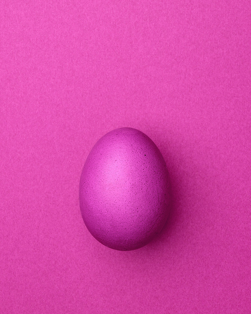 Pink Easter egg on a pink background