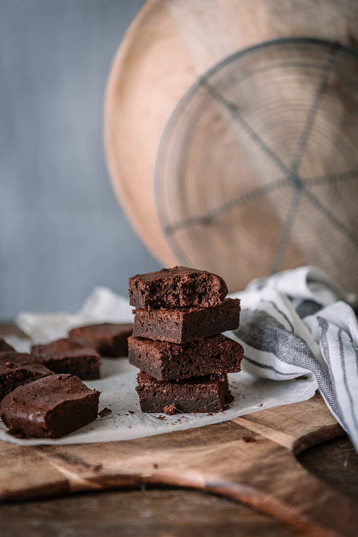 Yummy chocolate brownie pieces on cutting board