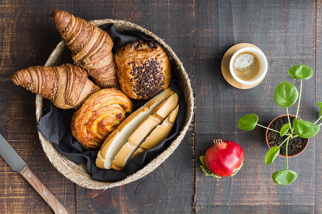 Arrangement of buns and cup of coffee