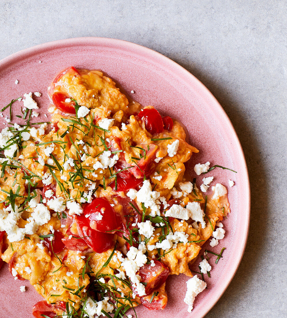 Scrambled egg with sheep's cheese and cherry tomatoes