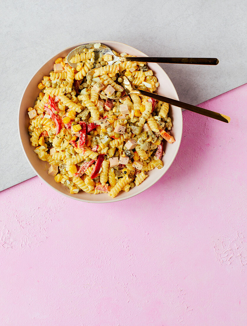 Pasta salad with eggs, sweetcorn, peas, pickles and bologna