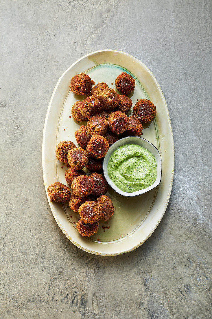 Lentil balls with a rocket and walnut dip