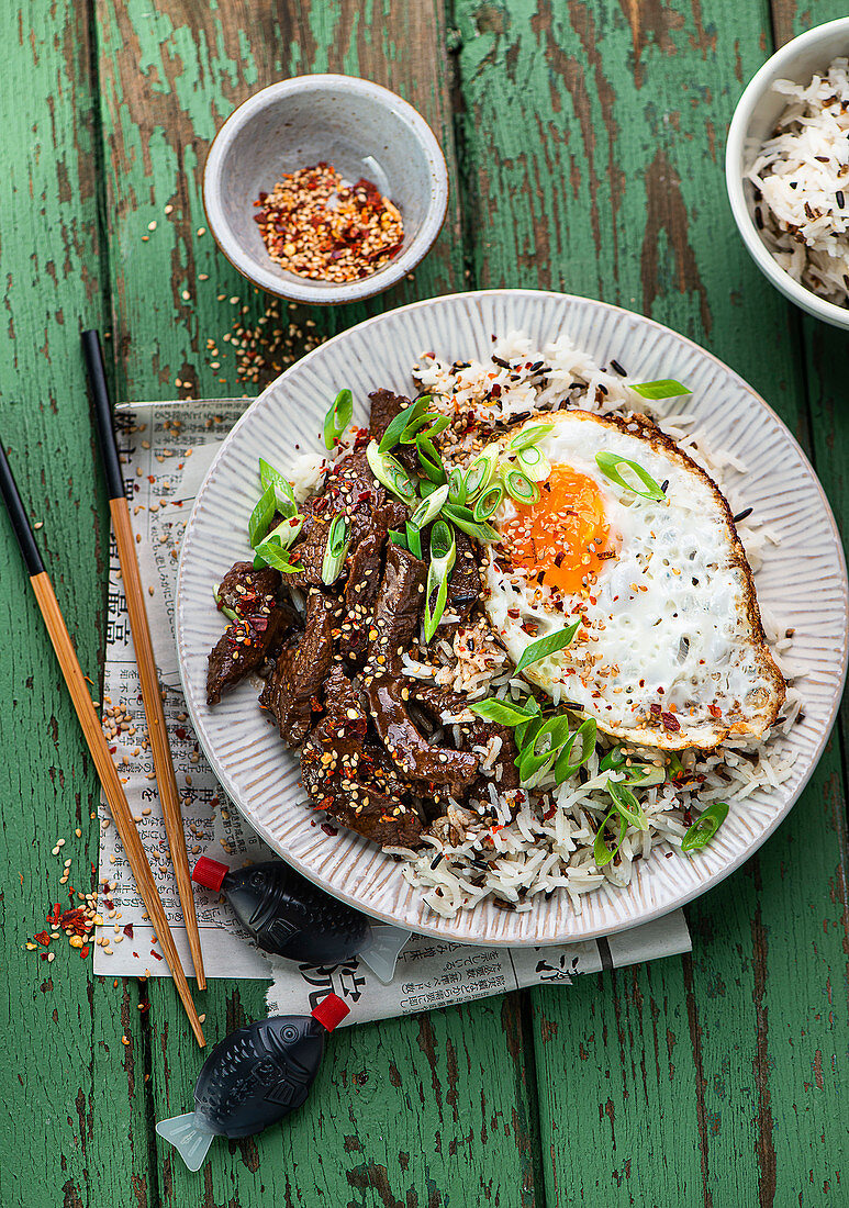 Rice with beef and fried egg (Asia)