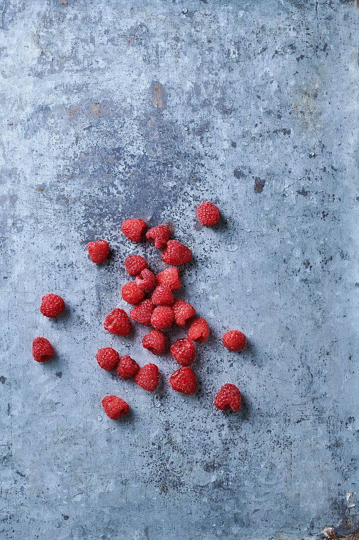 Fresh raspberries on on concrete background
