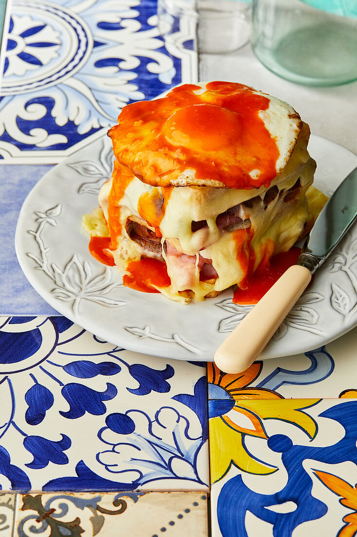 Francesinha (Portuguese toasted sandwich with meat, cheese, a fried egg and gravy)