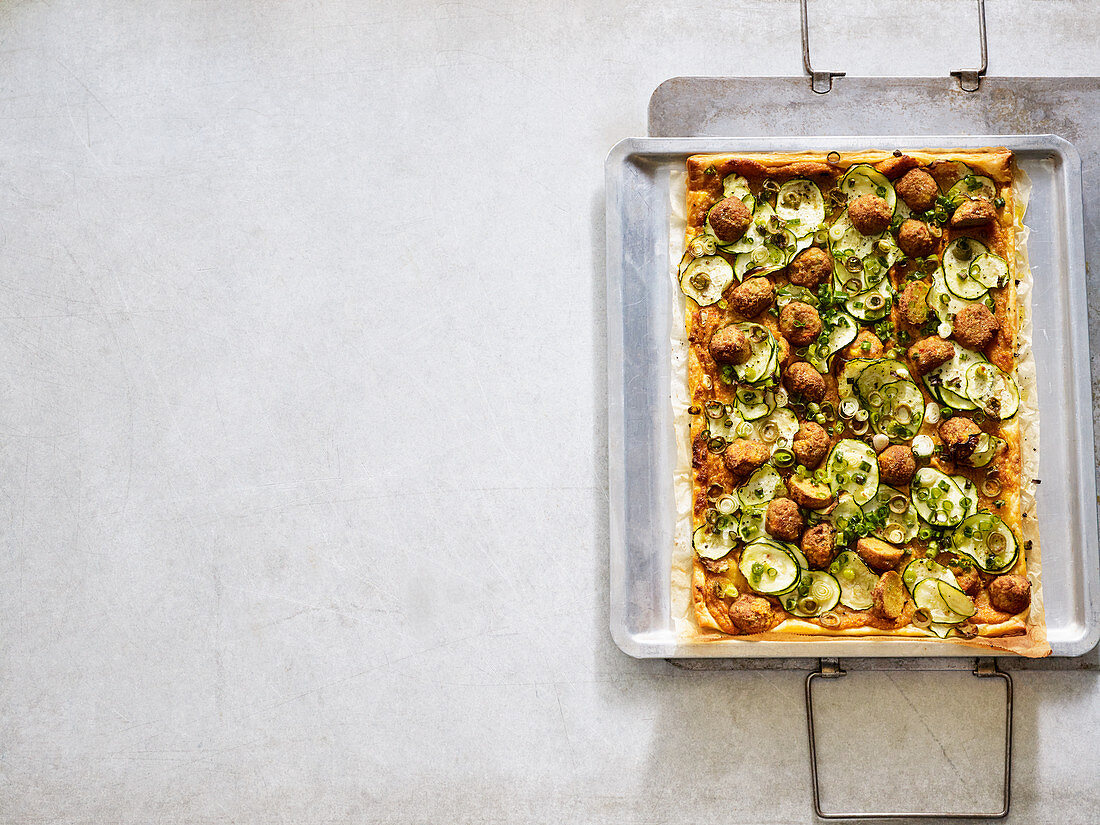 Courgette puff pastry tart with falafel and hummus